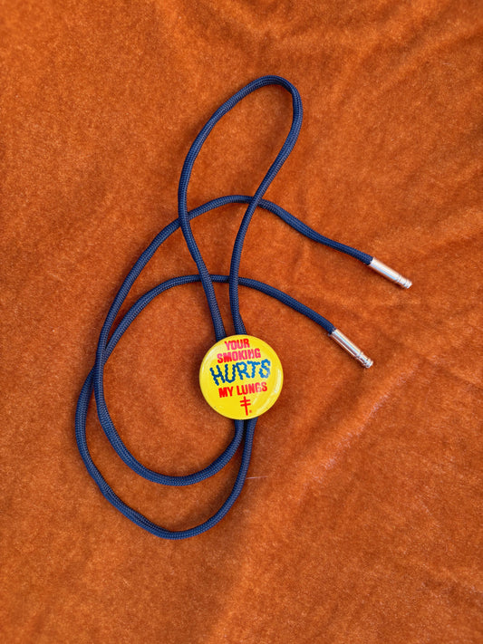 1970’s Pinback Button Bolo Tie - “Smoke Signals”